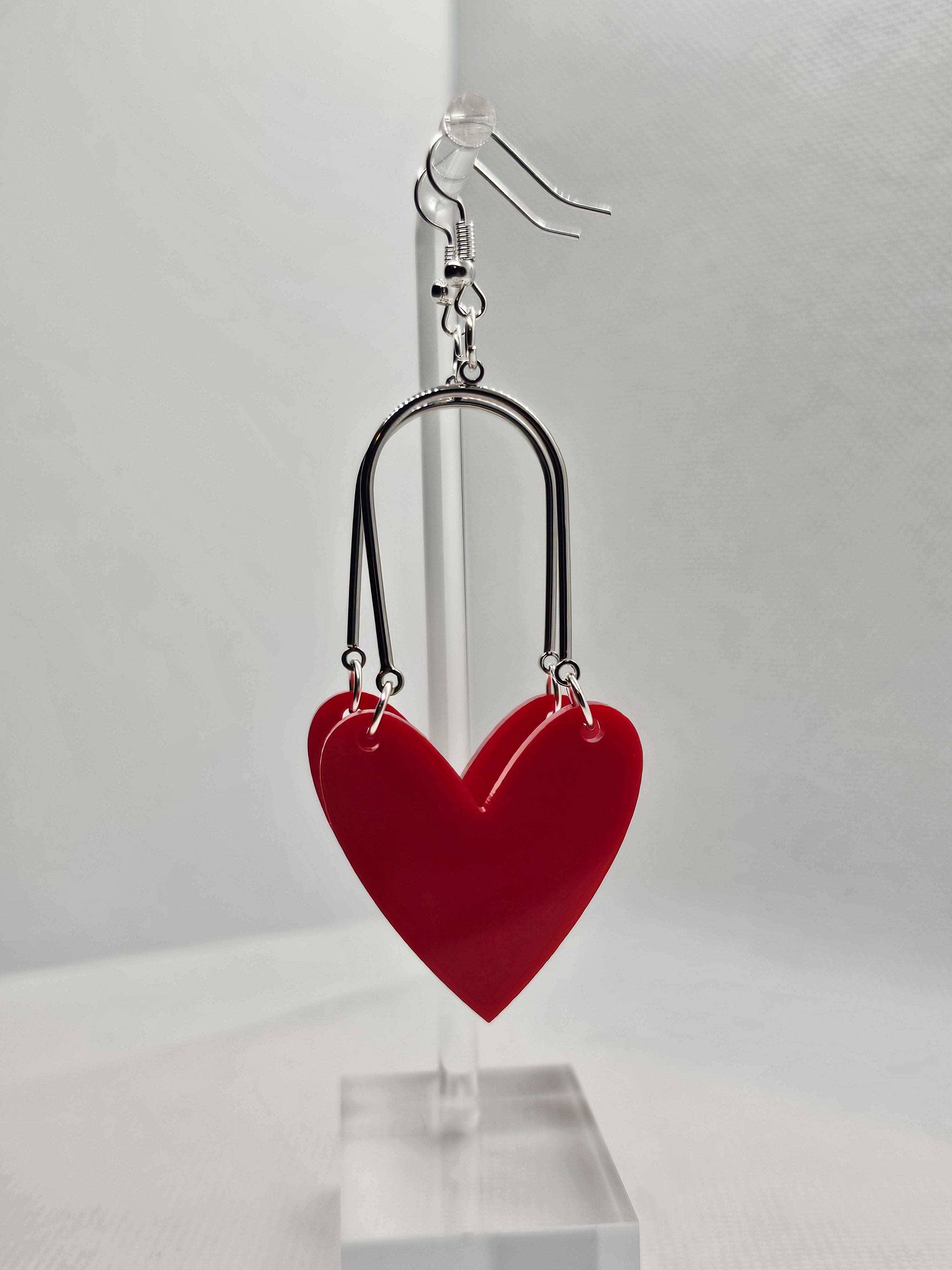 Red heart-shaped earrings.  image 0